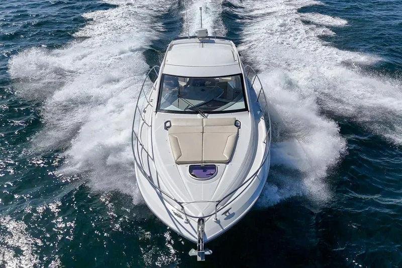 Slide: The Image of 2014 Beneteau Gran Turismo 38 yacht cruising on open water, aerial view. - 13