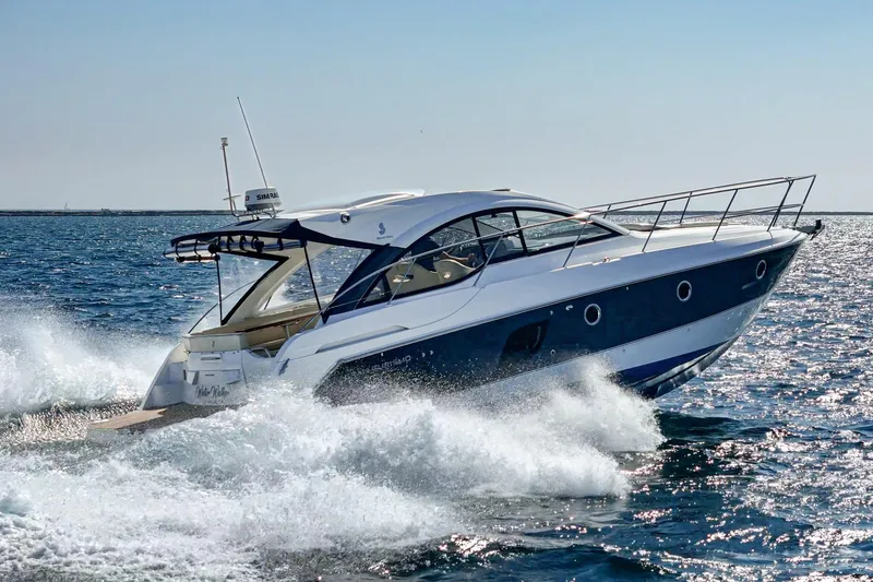Slide: The Image of 2014 Beneteau Gran Turismo 38 yacht cruising on open water. - 15