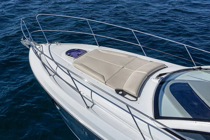 Slide: The Image of 2014 Beneteau Gran Turismo 38 yacht with sunbathing deck on open sea. - 16