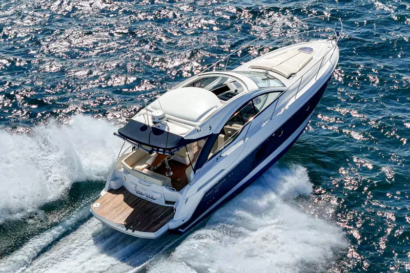 Slide: The Image of 2014 Beneteau Gran Turismo 38 yacht cruising on sparkling blue ocean waters. - 18