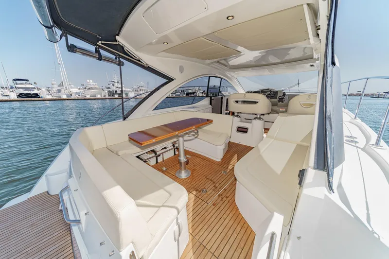 Slide: The Image of Luxurious 2014 Beneteau Gran Turismo 38 yacht interior with elegant seating and wooden flooring. - 22