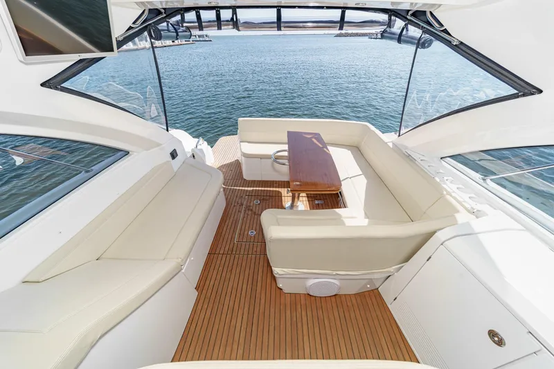 Slide: The Image of Luxurious 2014 Beneteau Gran Turismo 38 yacht interior with elegant seating and wooden table. - 23