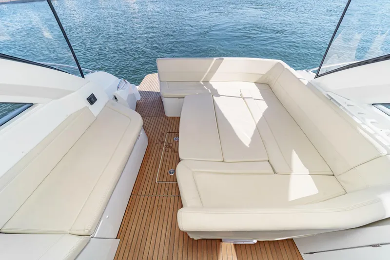 Slide: The Image of Luxurious seating area on 2014 Beneteau Gran Turismo 38 yacht with teak flooring. - 25