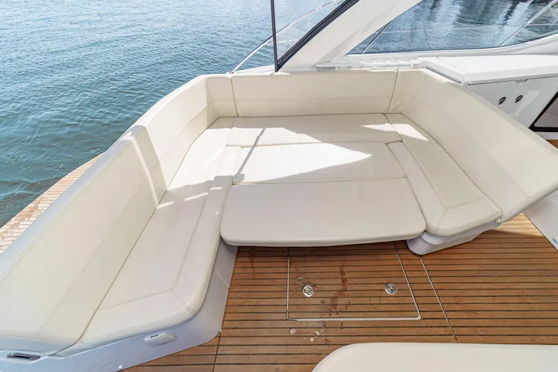 Slide: The Image of Luxurious seating area on 2014 Beneteau Gran Turismo 38 yacht, with elegant white cushions. - 26
