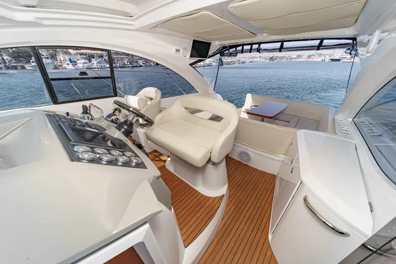 Slide: The Image of Interior of 2014 Beneteau Gran Turismo 38 yacht with helm and seating area. - 29