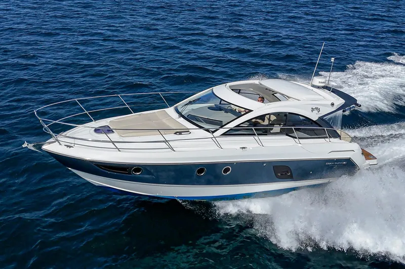 Slide: The Image of 2014 Beneteau Gran Turismo 38 cruising on open water, showcasing sleek design and performance. - 3