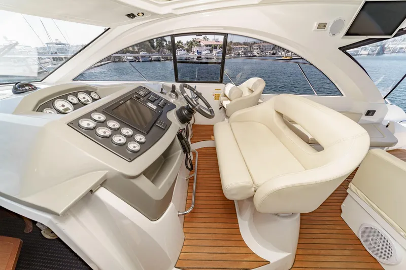 Slide: The Image of 2014 Beneteau Gran Turismo 38 yacht cockpit with modern controls and plush seating. - 30