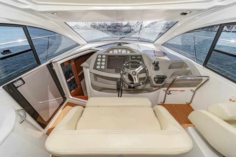 Slide: The Image of 2014 Beneteau Gran Turismo 38 yacht cockpit with modern steering and navigation controls. - 31