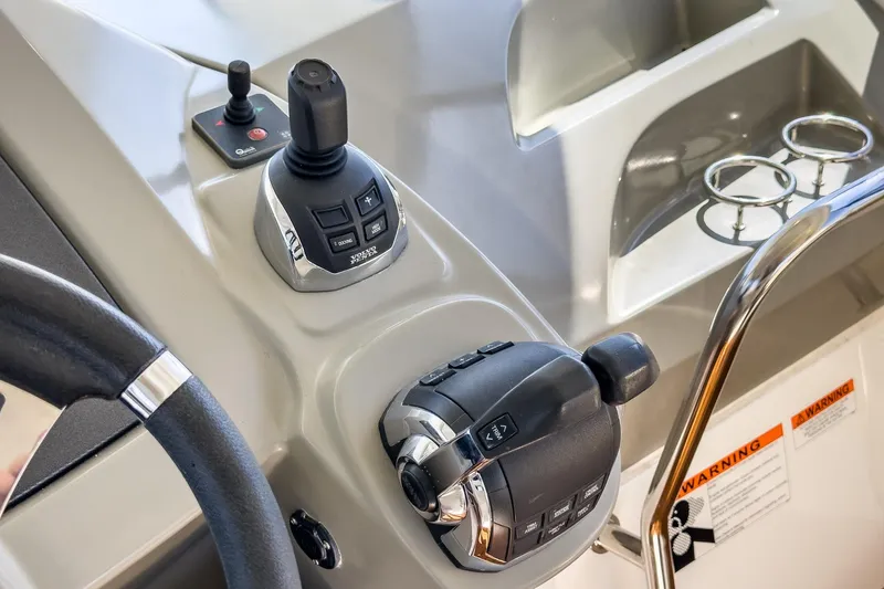 Slide: The Image of Control panel of a 2014 Beneteau Gran Turismo 38 yacht with joystick and throttle. - 33