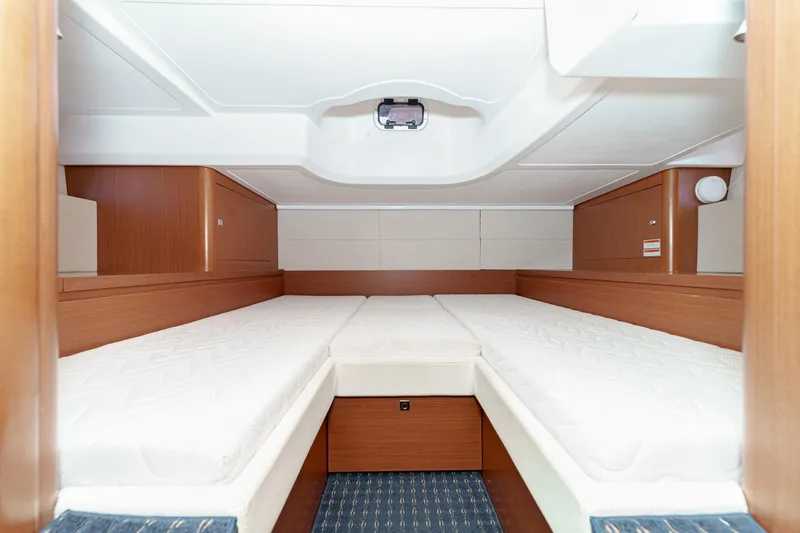 Slide: The Image of Interior cabin of 2014 Beneteau Gran Turismo 38 yacht with twin beds and wooden finish. - 43