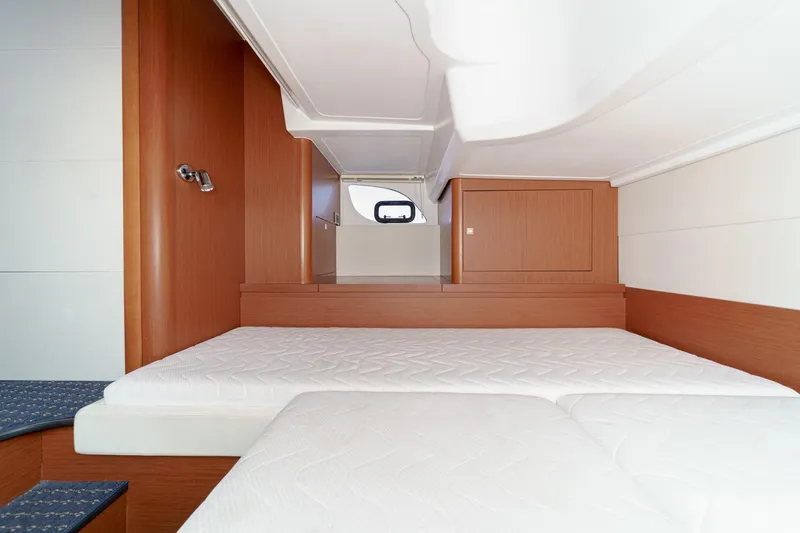 Slide: The Image of Interior cabin of 2014 Beneteau Gran Turismo 38 yacht with twin beds and wooden finish. - 44