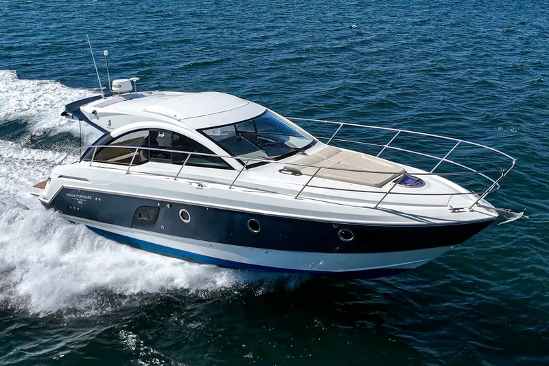 Slide: The Image of 2014 Beneteau Gran Turismo 38 cruising on open water, showcasing sleek design and performance. - 5