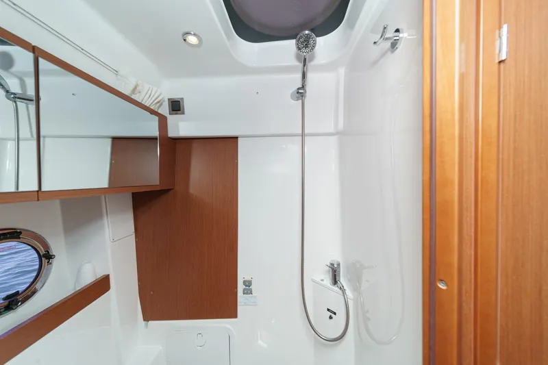 Slide: The Image of Bathroom interior of 2014 Beneteau Gran Turismo 38 yacht, featuring shower and wooden accents. - 50