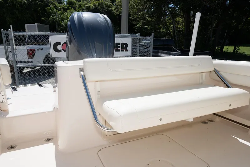 Slide: The Image of 2023 Grady-White Freedom 235 boat with white seating and outboard motor. - 11