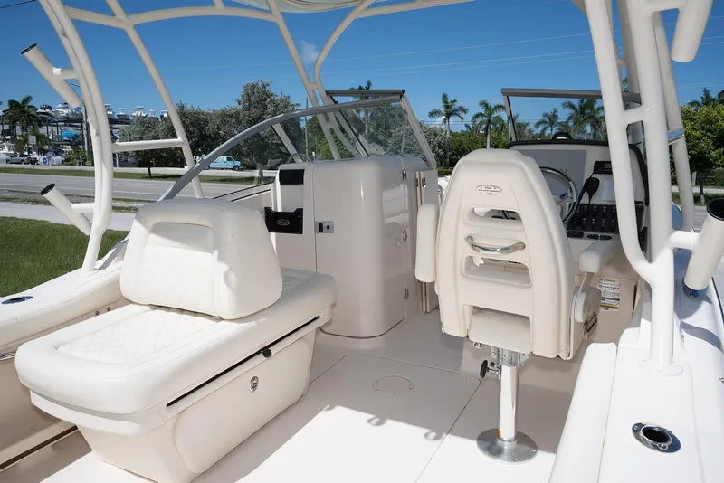 Slide: The Image of 2023 Grady-White Freedom 235 boat interior with seating and steering console. - 12