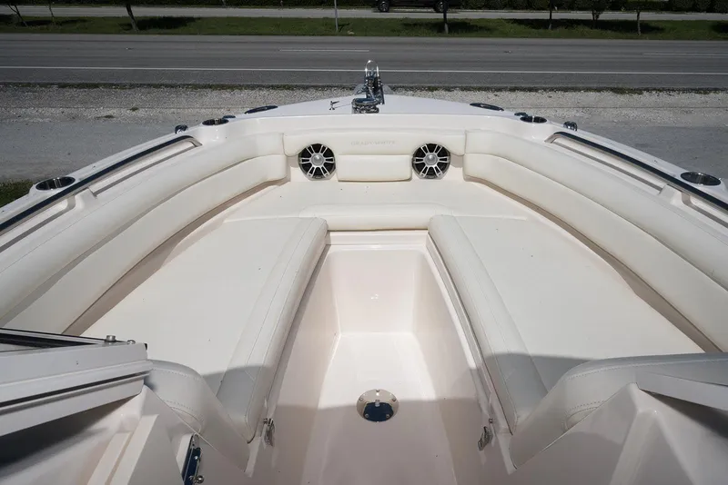 Slide: The Image of 2023 Grady-White Freedom 235 boat interior with spacious seating and cup holders. - 26