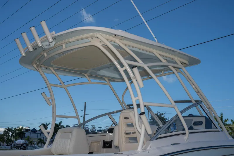 Slide: The Image of 2023 Grady-White Freedom 235 boat with T-top against blue sky. - 3