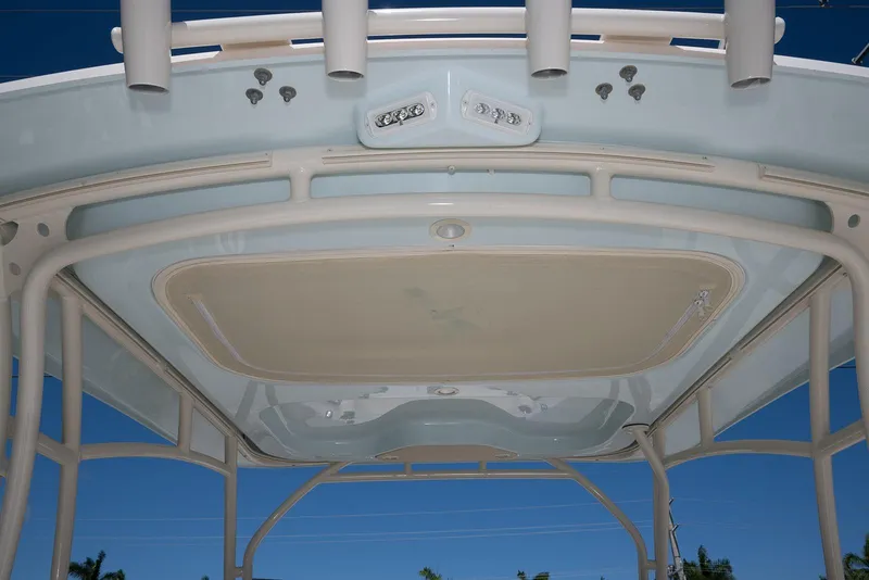 Slide: The Image of 2023 Grady-White Freedom 235 boat canopy with rod holders and lighting fixtures. - 6