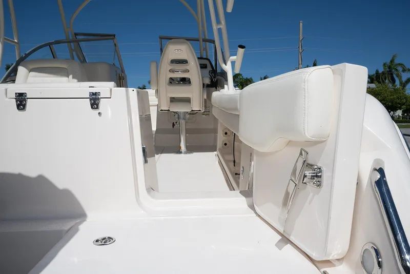Slide: The Image of 2023 Grady-White Freedom 235 boat interior with white seating and sleek design. - 8