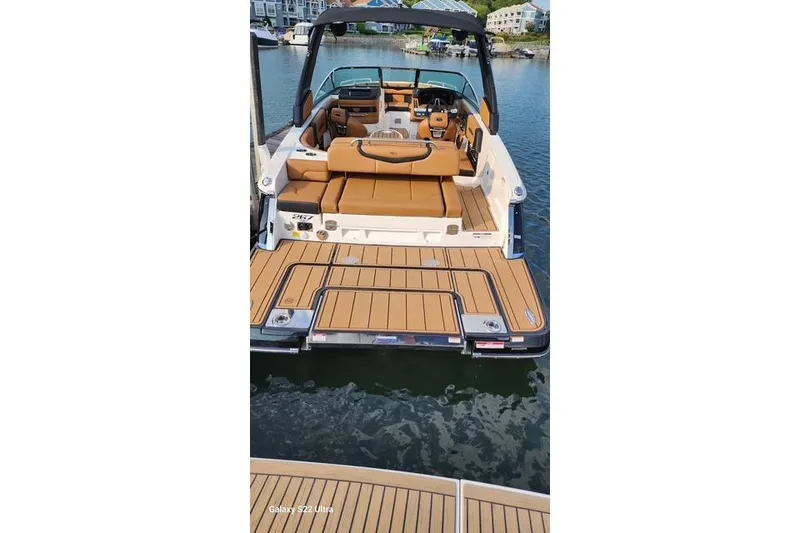 Slide: The Image of Luxurious interior of 2023 Chaparral 267 SSX boat with tan and black seating. - 6