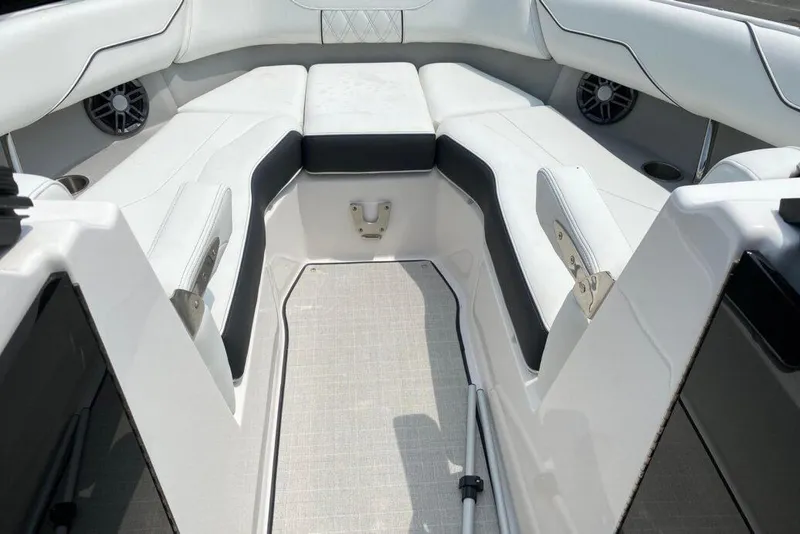 Slide: The Image of 2023 Regal LX4 boat interior with white and black seating, modern design. - 4