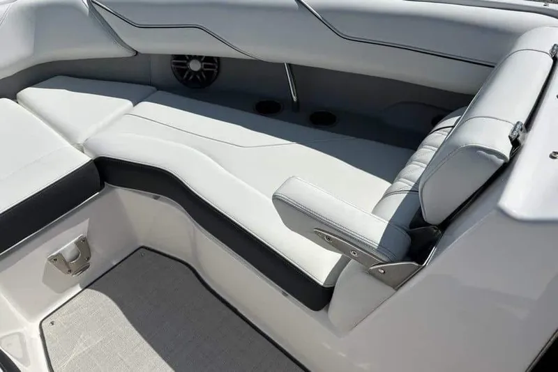 Slide: The Image of 2023 Regal LX4 boat interior with sleek, modern seating and cup holders. - 6