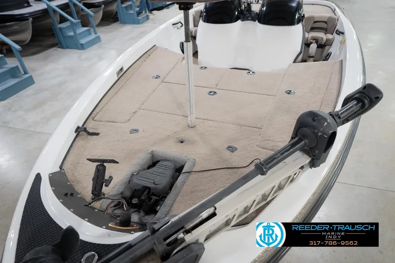 Slide: The Image of 2003 Nitro 911 CDC boat interior with beige seating and carpeted deck. - 11