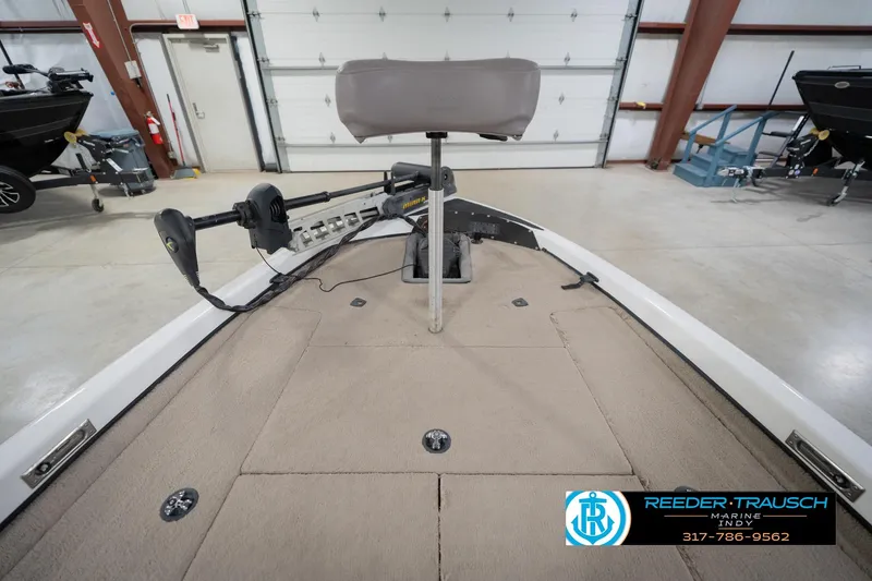 Slide: The Image of 2003 Nitro 911 CDC boat interior with seating, displayed in a showroom with other boats. - 17