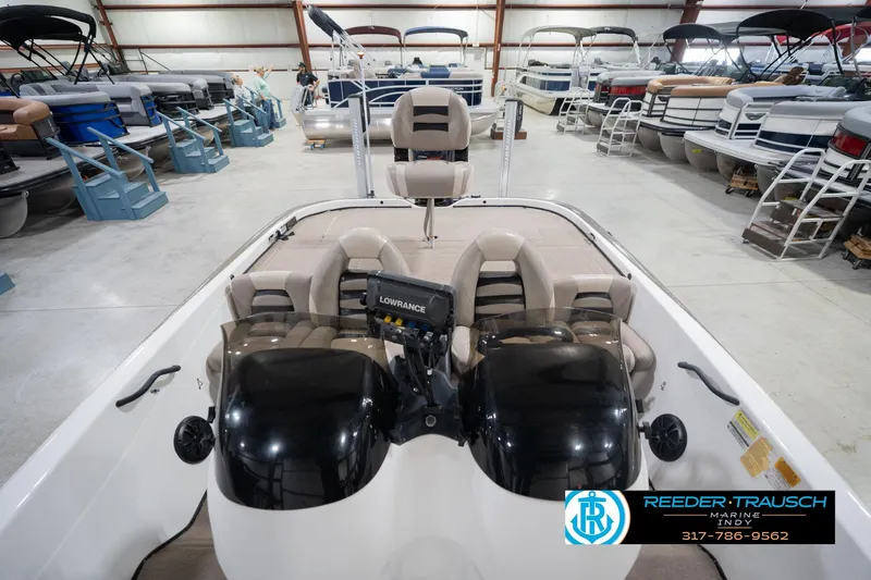 Slide: The Image of 2003 Nitro 911 CDC boat interior with seating and Yamaha outboard motor in showroom. - 19