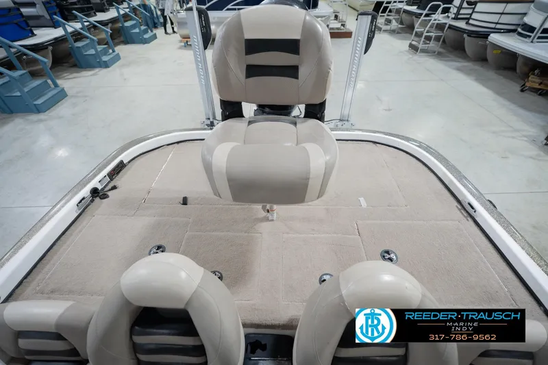Slide: The Image of Indoor boat showroom featuring a 2003 Nitro 911 CDC with Yamaha engine, surrounded by various pontoon boats. - 20