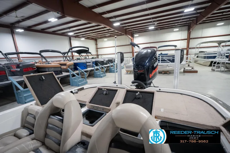 Slide: The Image of 2003 Nitro 911 CDC boat interior in a garage with another boat in the background. - 23