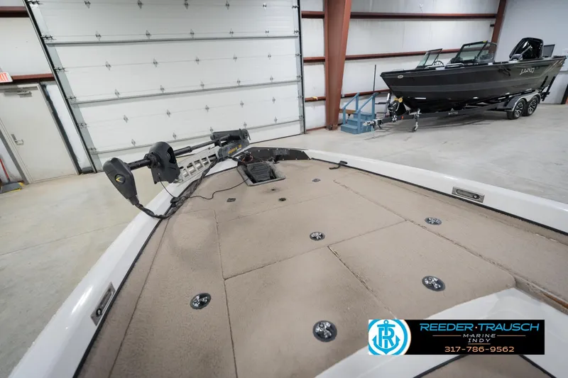 Slide: The Image of 2003 Nitro 911 CDC boat dashboard with steering wheel and control panel. - 25