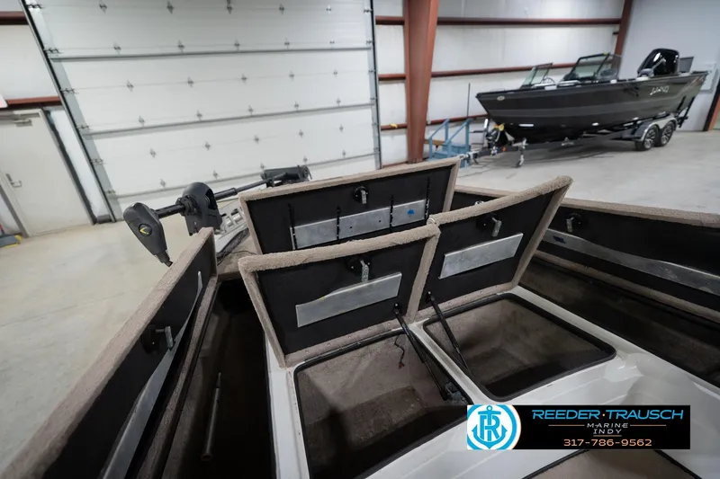 Slide: The Image of 2003 Nitro 911 CDC boat dashboard with steering wheel and control panel. - 26