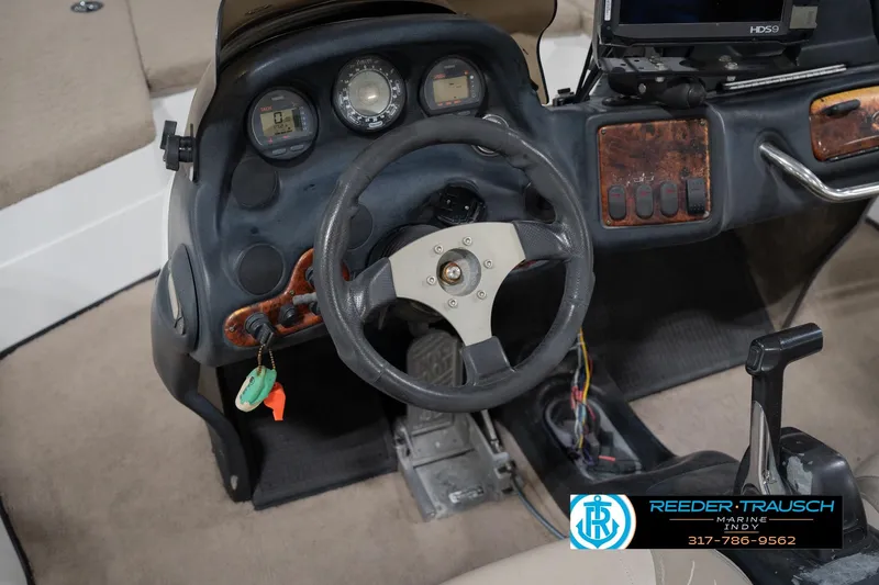 Slide: The Image of Dashboard controls of a 2003 Nitro 911 CDC boat with key ignition. - 28