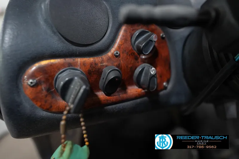 Slide: The Image of Close-up of a 2003 Nitro 911 CDC marine gauge panel with digital displays. - 30