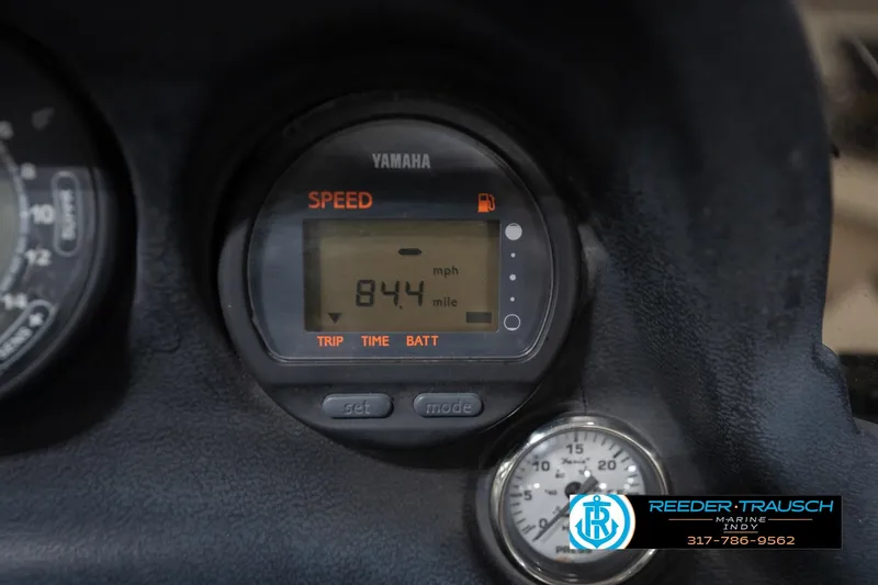 Slide: The Image of Dashboard switch panel of a 2003 Nitro 911 CDC boat with wood finish. - 33