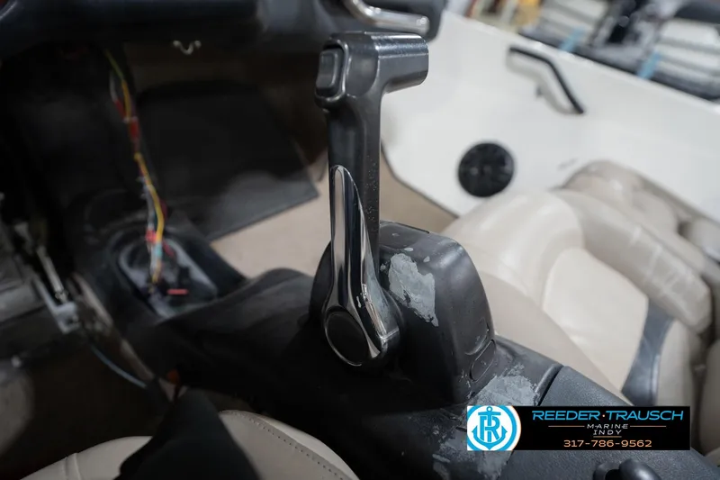 Slide: The Image of 2003 Nitro 911 CDC boat interior with beige and black cushioned seats. - 38