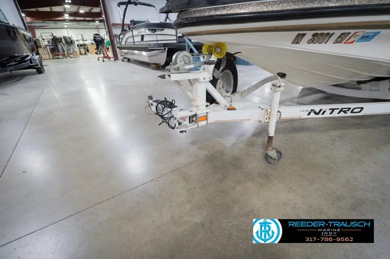 Slide: The Image of Close-up of a 2003 Nitro 911 CDC boat latch on carpeted surface. - 57