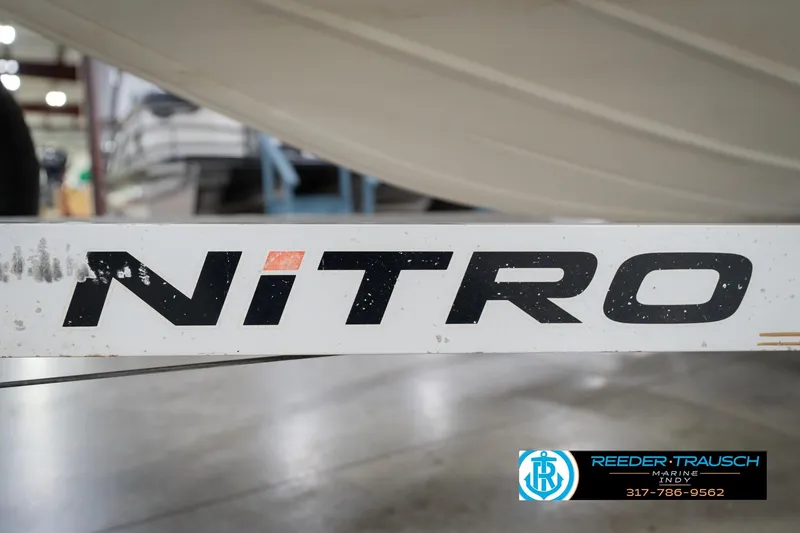 Slide: The Image of 2003 Nitro 911 CDC boat capacity label, 4 persons or 1030 lbs, 300 HP motor. - 59