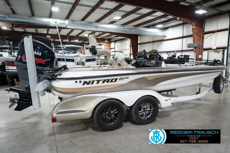 Slide: The Image of 2003 Nitro 911 CDC boat with Yamaha VMAX engine in a showroom. - 7