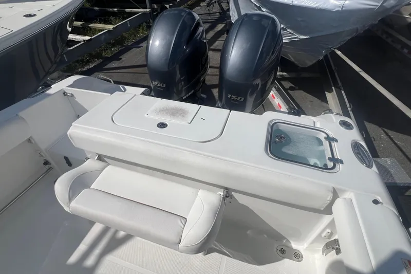 Slide: The Image of 2019 Sea Hunt Gamefish 25 boat with dual 150 horsepower engines and seating area. - 5