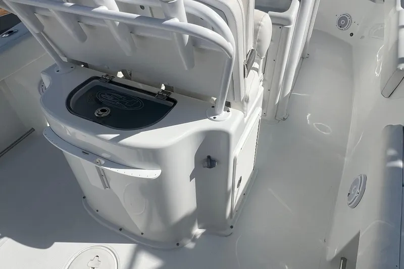 Slide: The Image of 2019 Sea Hunt Gamefish 25 boat interior with seating and storage compartments. - 6