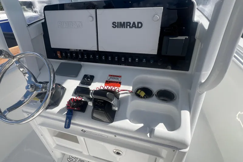 Slide: The Image of 2019 Sea Hunt Gamefish 25 helm with Simrad electronics and Yamaha controls. - 7