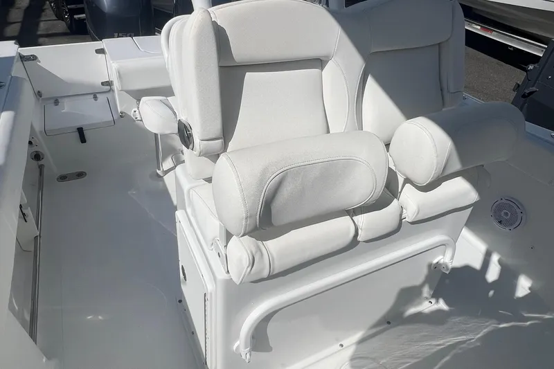 Slide: The Image of 2019 Sea Hunt Gamefish 25 boat interior with white cushioned seating. - 8