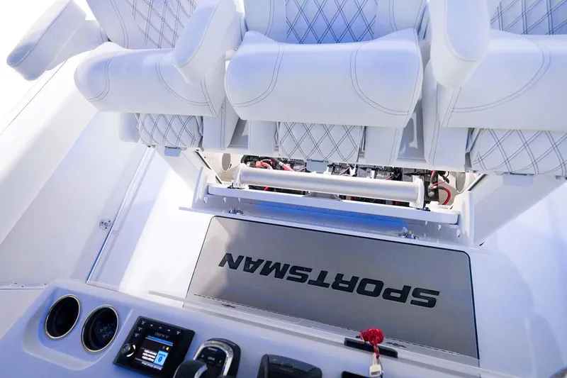 Slide: The Image of Manufacturer Provided Image: 2025 Sportsman Open 352 Center Console interior with white seating and control panel. - 14
