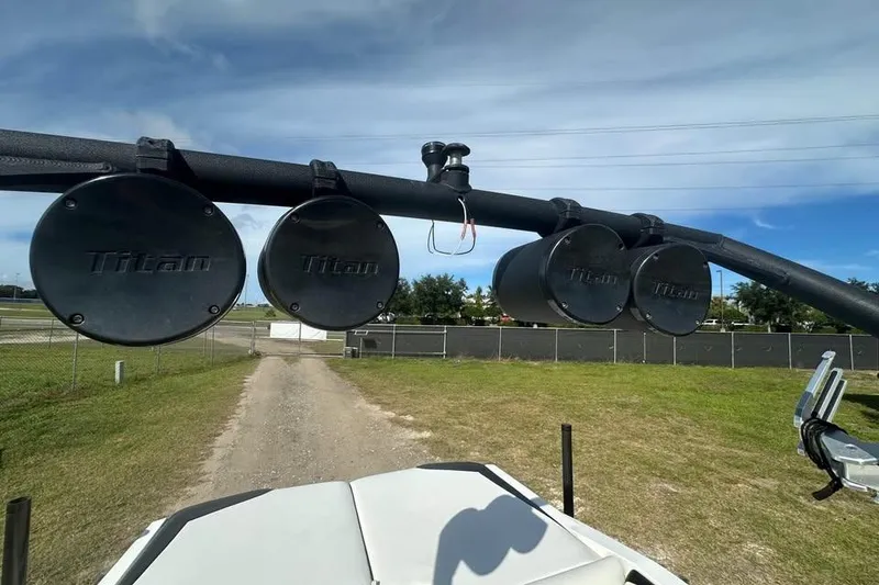 Slide: The Image of Titan speakers on a 2012 Axis A20 boat, mounted on a black tower. - 4
