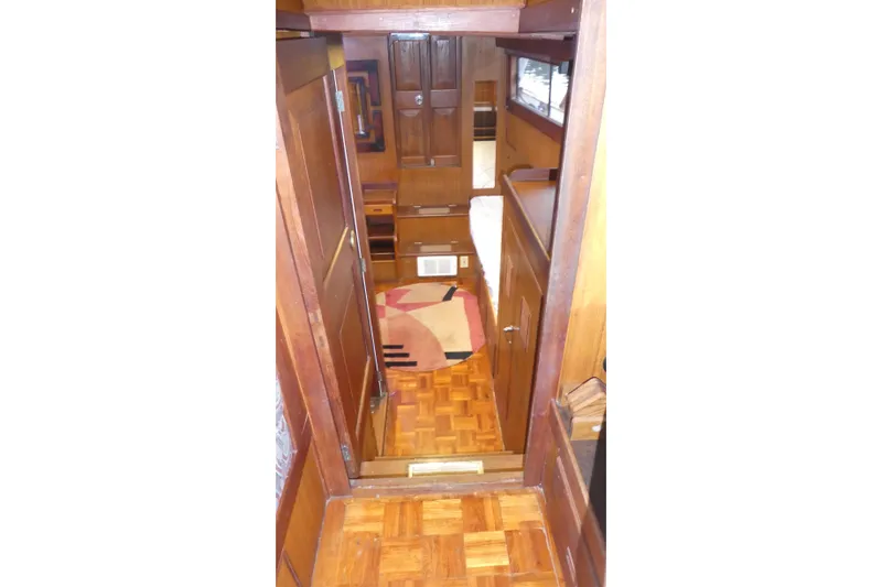 Slide: The Image of Interior of 1979 Hiptimco 40' Trawler with wooden cabinetry and parquet flooring. - 15