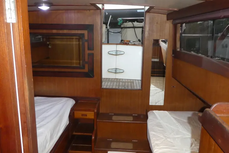 Slide: The Image of 1979 Hiptimco 40' Trawler interior with wooden paneling and twin beds. - 17