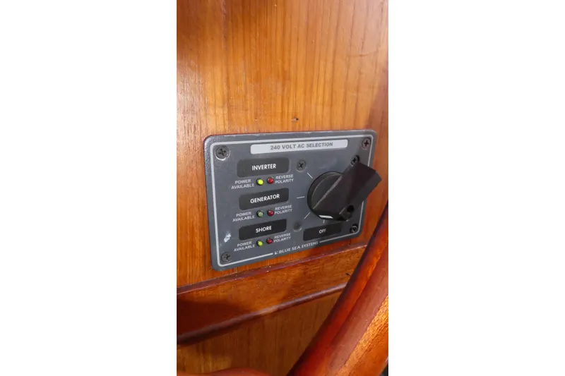 Slide: The Image of Control panel on 1979 Hiptimco 40' Trawler, featuring inverter and generator switches. - 23
