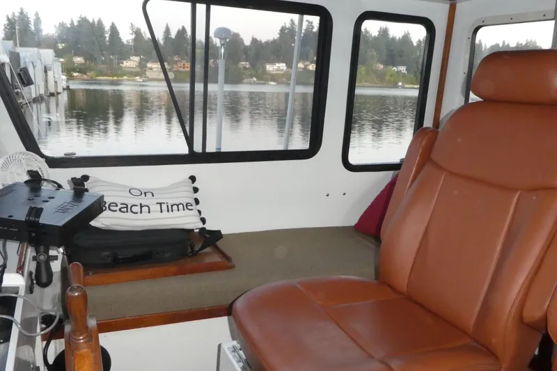 Slide: The Image of Interior of 1979 Hiptimco 40' Trawler with leather seating and scenic water view. - 33